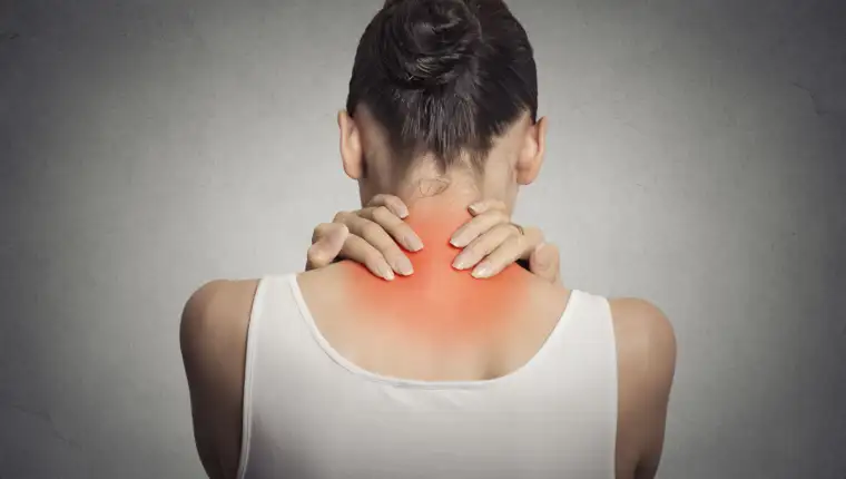Back spine disease. Closeup view tired female massaging her neck
