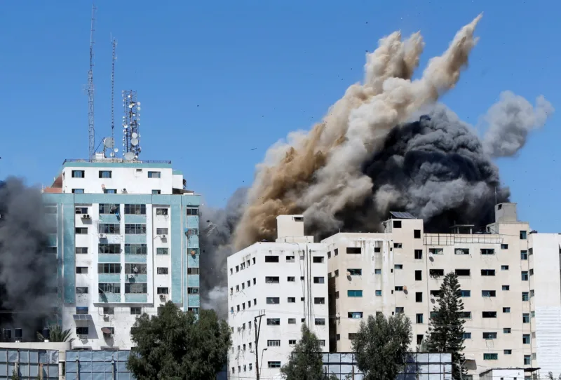 A tower housing AP, Al Jazeera offices collapses after Israeli missile strikes in Gaza city