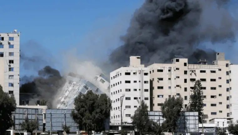 The Al Jalaa Tower housing Al Jazeera and The Associated Press offices collapses after being hit by Israeli missile in Gaza City 696x463 1
