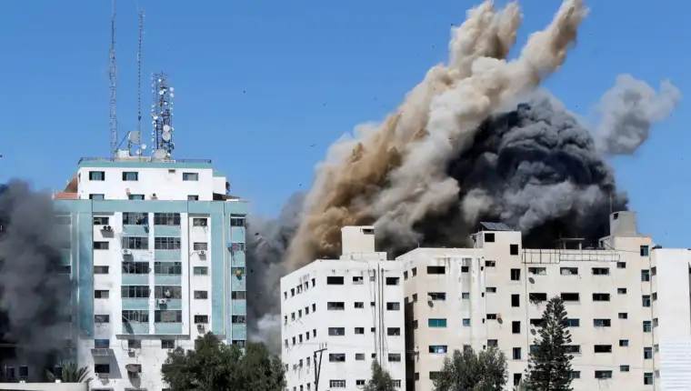 A tower housing AP, Al Jazeera offices collapses after Israeli missile strikes in Gaza city