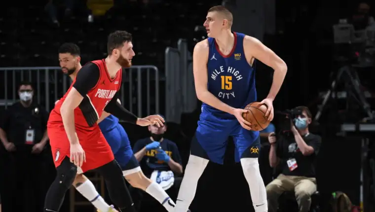 67ac2320-jusuf-nurkic-guards-nikola-jokic-blazers-at-nuggets-game-1-getty-images