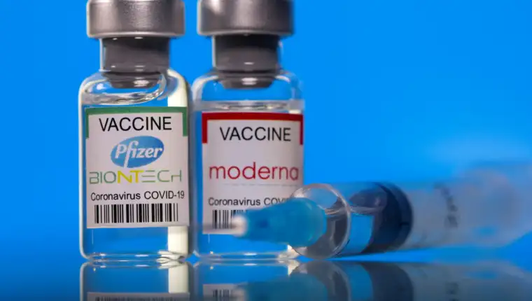FILE PHOTO: Picture illustration of vials with Pfizer-BioNTech and Moderna coronavirus disease (COVID-19) vaccine labels