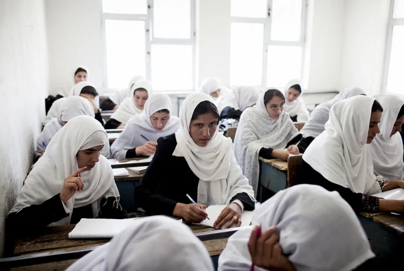 Female Afghan students work during a class at the Jamal Agha Girls School.