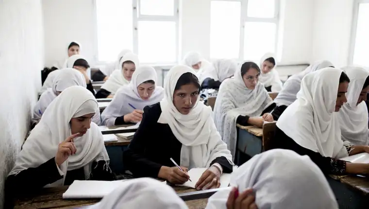 Female Afghan students work during a class at the Jamal Agha Girls School.
