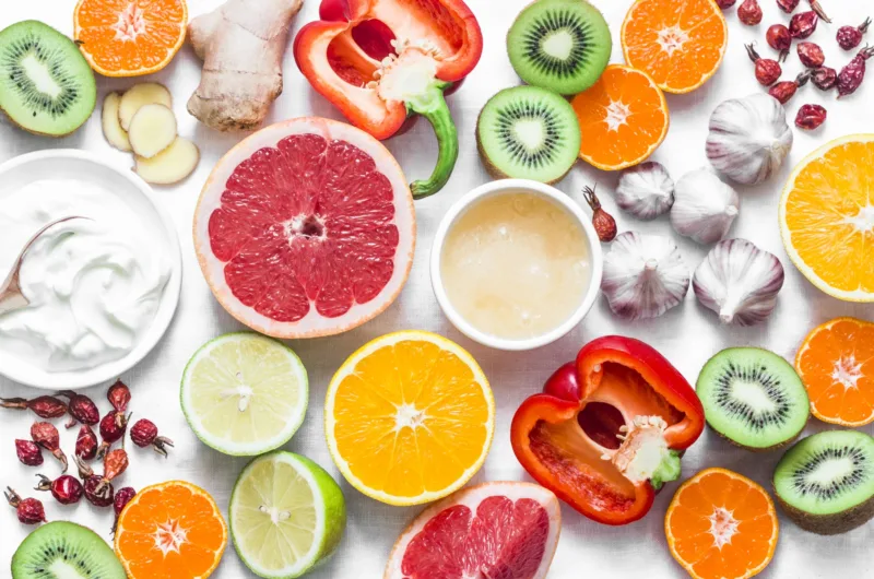 Immunity  boosting food set on a light background . Healthy lifestyle concept, winter prevention of colds. Flat lay, top view