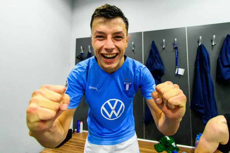 210824 Anel Ahmedhodzic of Malmˆ FF celebrate in the locker room after winning the UEFA Champions League playoff match