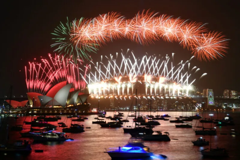 The midnight fireworks are seen from Mrs Macquarie's Chair during New Year's Eve celebrations in Sydney