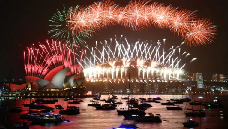 The midnight fireworks are seen from Mrs Macquarie's Chair during New Year's Eve celebrations in Sydney