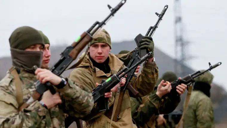FILE PHOTO: Militants of the self-proclaimed Donetsk People's Republic train at a range in Donetsk