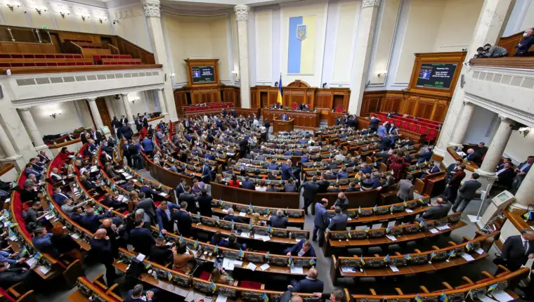Ukrainian lawmakers attend a session of parliament in Kyiv