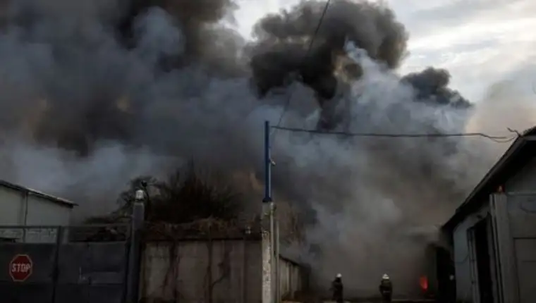 Firefighters try to contain a fire at a plant following Russian shelling, as Russia's attack on Ukraine continues, in Kharkiv