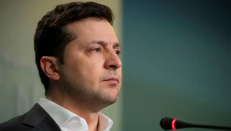 Ukrainian President Volodymyr Zelenskiy attends a news briefing in Kyiv