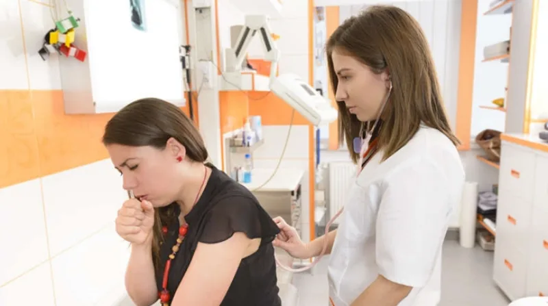 Doctor,Consulting,A,Patient,Woman,Coughing,With,A,Stethoscope