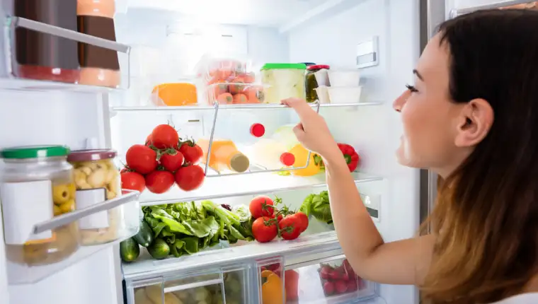 Close-up,Of,Young,Woman,Searching,For,Food,In,The,Fridge