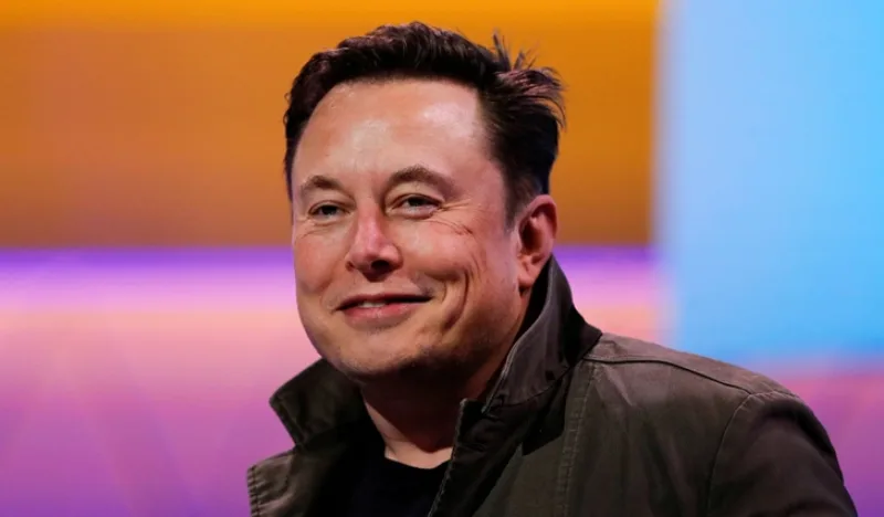 FILE PHOTO: SpaceX owner and Tesla CEO Elon Musk smiles during a conversation with legendary game designer Todd Howard at the E3 gaming convention in Los Angeles