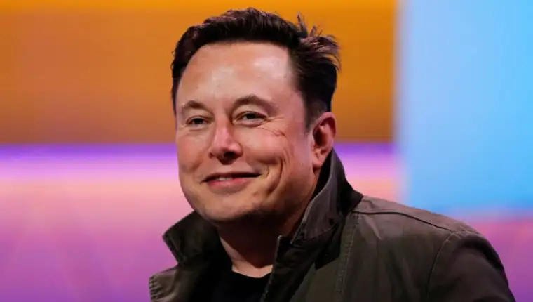 FILE PHOTO: SpaceX owner and Tesla CEO Elon Musk smiles during a conversation with legendary game designer Todd Howard at the E3 gaming convention in Los Angeles