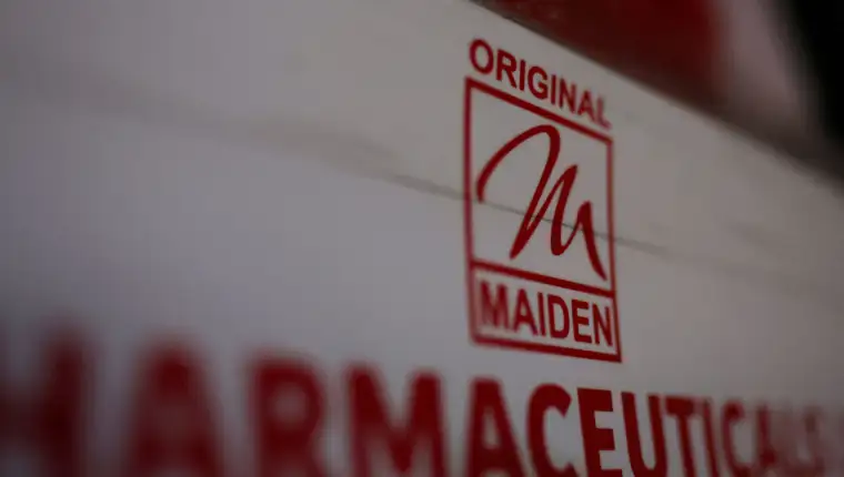 FILE PHOTO: FILE PHOTO: Logo of the Maiden Pharmaceuticals Ltd. company is seen on a board put up outside their office in New Delhi,