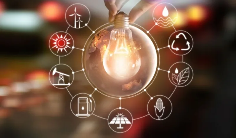 hand-holding-light-bulb-in-front-of-global-show-the-worlds-with-picture-id848543146.REV_