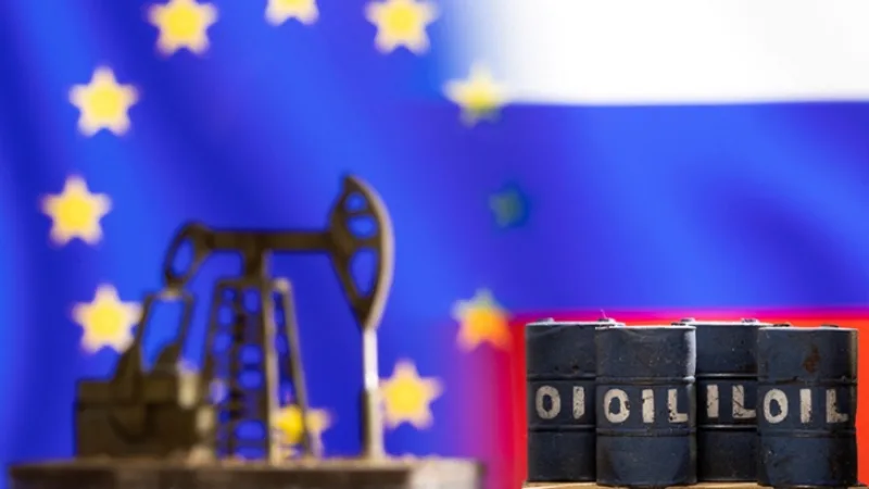 FILE PHOTO: Illustration shows models of oil barrels and a pump jack in front of U.S. and Russia flag colors