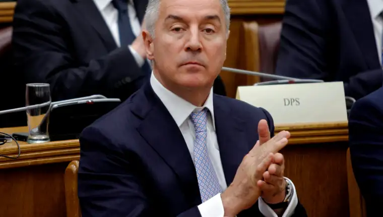President of a ruling Democratic Party of Socialist (DPS), former prime minister and president of Montenegro, Milo Djukanovic applauds during a parliament discussion on NATO membership agreement in Cetinje