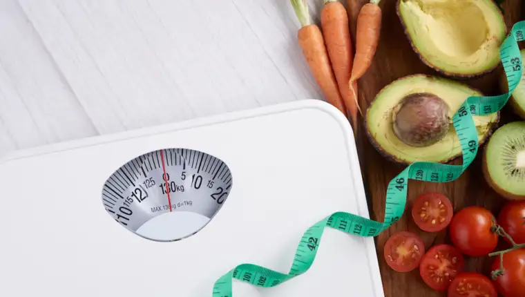 Weight loss scale with centimeter. Diet concept. Healthy food background. Food photography different fruits and vegetables. concept slimming diet fresh vegetables. top view.