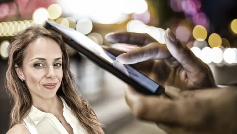 Woman,Using,Her,Mobile,Phone,In,The,Street,,Night,Light