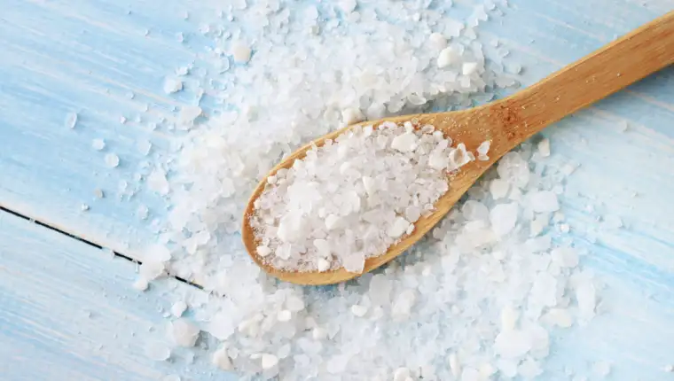 Sea salt on wooden table wooden spoon