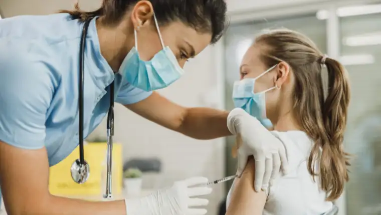 Nurse,Giving,The,Covid-19,Vaccine,To,A,Cute,Teenager,Girl