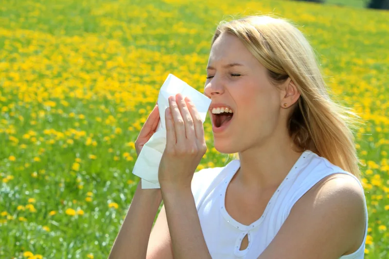 Women with pollen allergy in a Spring Meadow