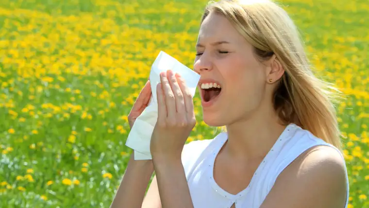 Women with pollen allergy in a Spring Meadow
