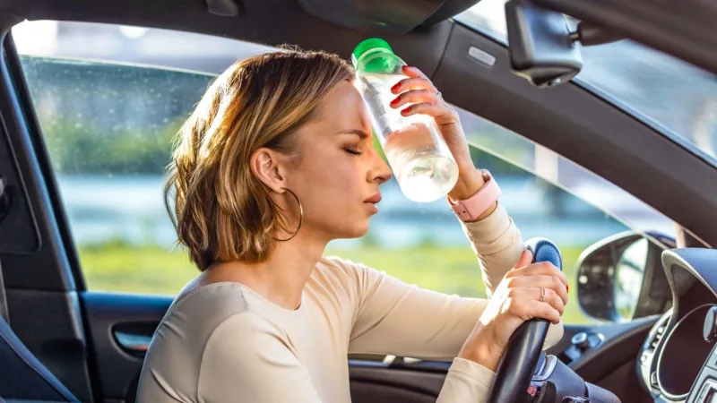 Exhausted,Woman,Driver,Feeling,Headache,,Sitting,Inside,Her,Car,,Applies