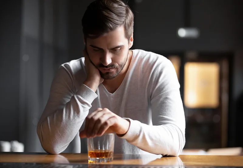 Upset,Young,Man,Drinker,Alcoholic,Sitting,At,Bar,Counter,With
