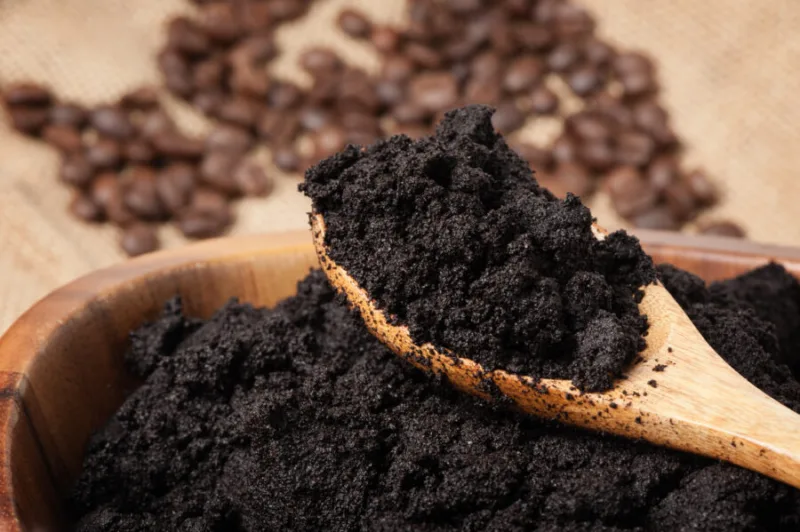 Closeup,Detail,Of,Coffee,Ground,In,Wooden,Bowl