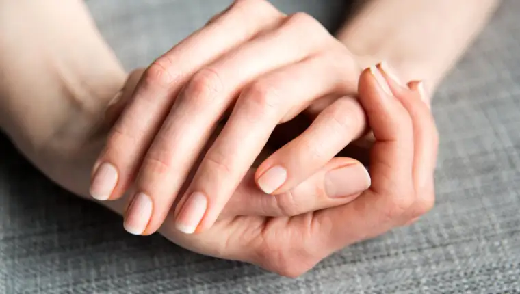 Female,Hands,On,Gray,Background