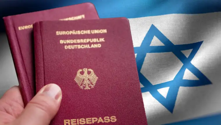 Two,German,Passport,In,Male,Hand,On,Check,In.,Concept