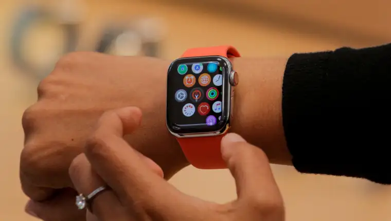 FILE PHOTO: An Apple Store employee shows the Series 5 Apple Watch in New York