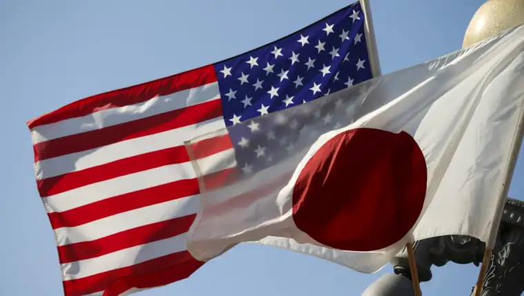 FILE PHOTO: Japan and U.S. flags fly outside the White House in Washington
