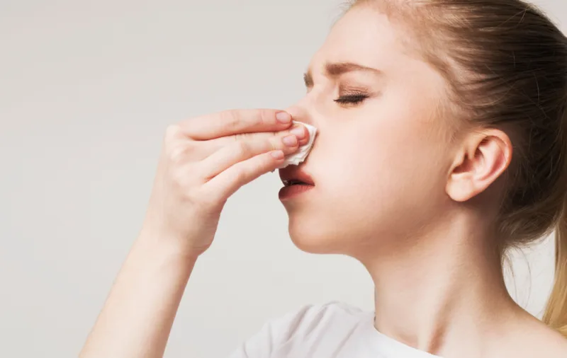 High,Blood,Pressure.,Young,Woman,Suffering,From,Nose,Bleeding,,Stop