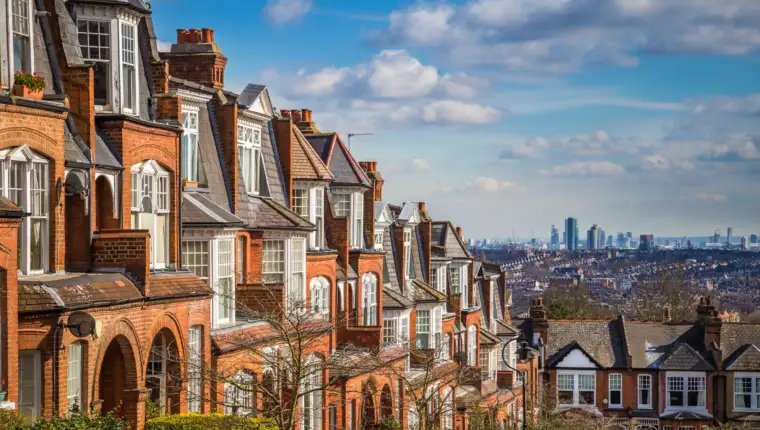 London, England - Typical brick houses and flats and panoramic view of london on a nice summer morning with blue sky and clouds taken from Muswell Hill