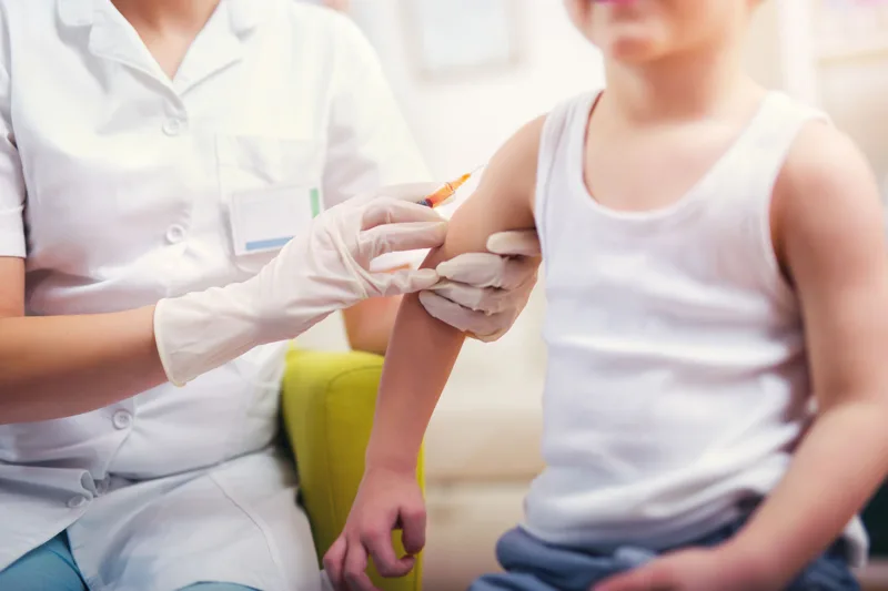 Pediatrician,Makes,Vaccination,To,Small,Boy