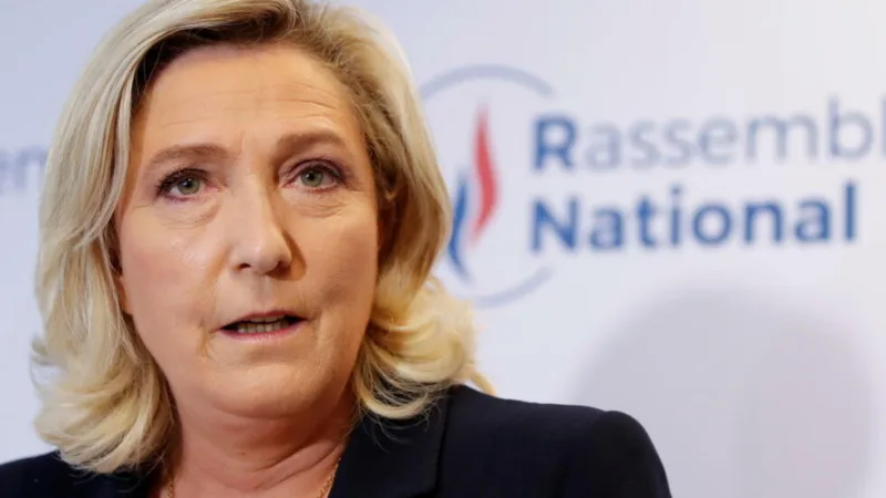 FILE PHOTO: French far right leader Marine Le Pen reacts to the results of regional election, in Nanterre
