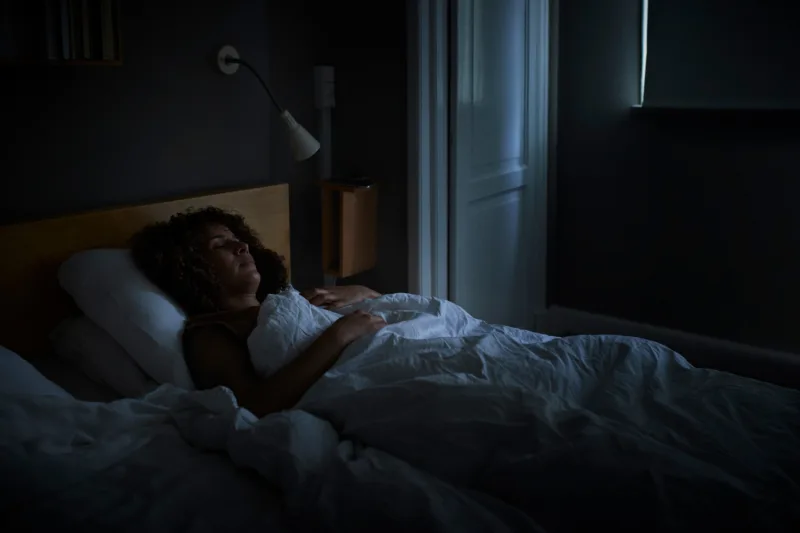 Woman sleeping on bed