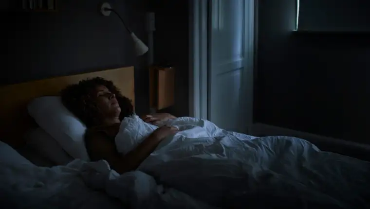 Woman sleeping on bed