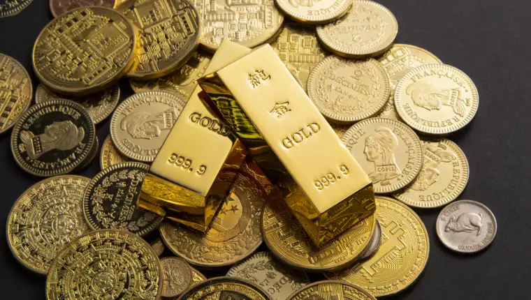 Coins, and gold bars scattered on a table
