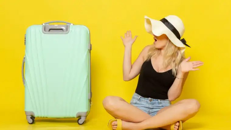 front-view-young-female-sitting-along-with-her-green-bag-yellow-desk-trip-vacation-sun-voyage-journey-girl