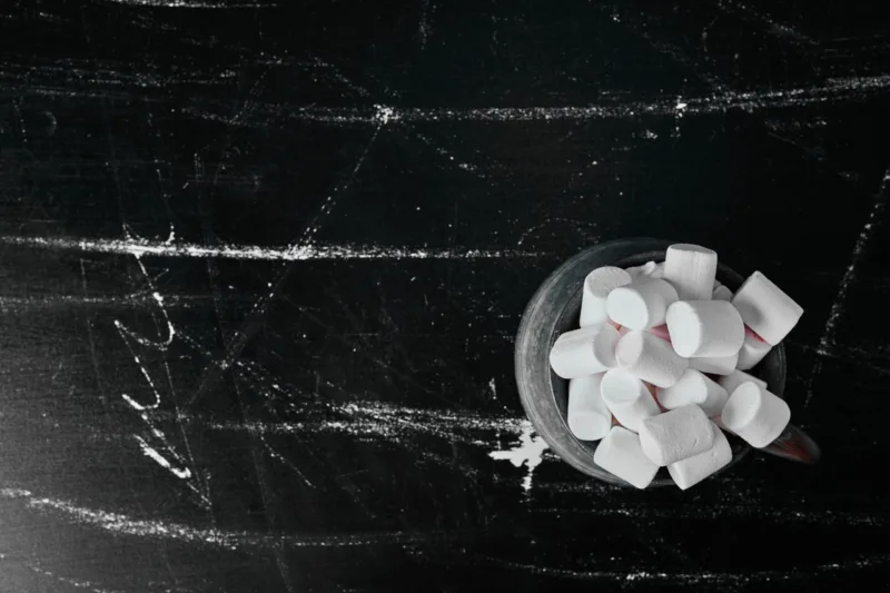 White marshmallows in a metallic cup