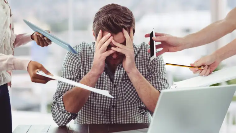 Stressed man frustrated with electronic devices