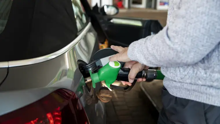 close-up-hand-pumping-gas-car