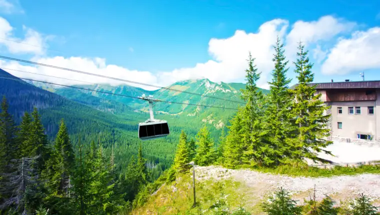 Gondola cable car in mountains.