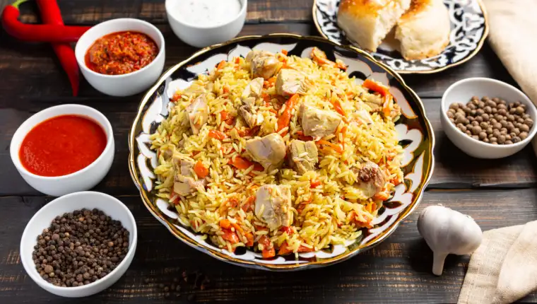 National Uzbek pilaf with meat in a cast-iron skillet